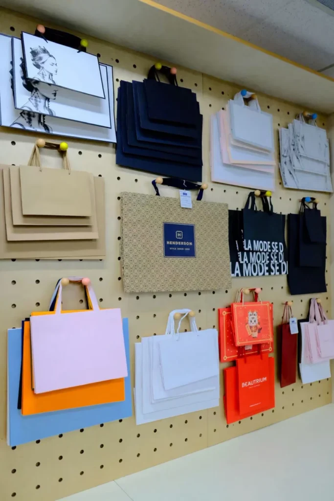 Paper shopping bags in different sizes and finishes at our West Coast office