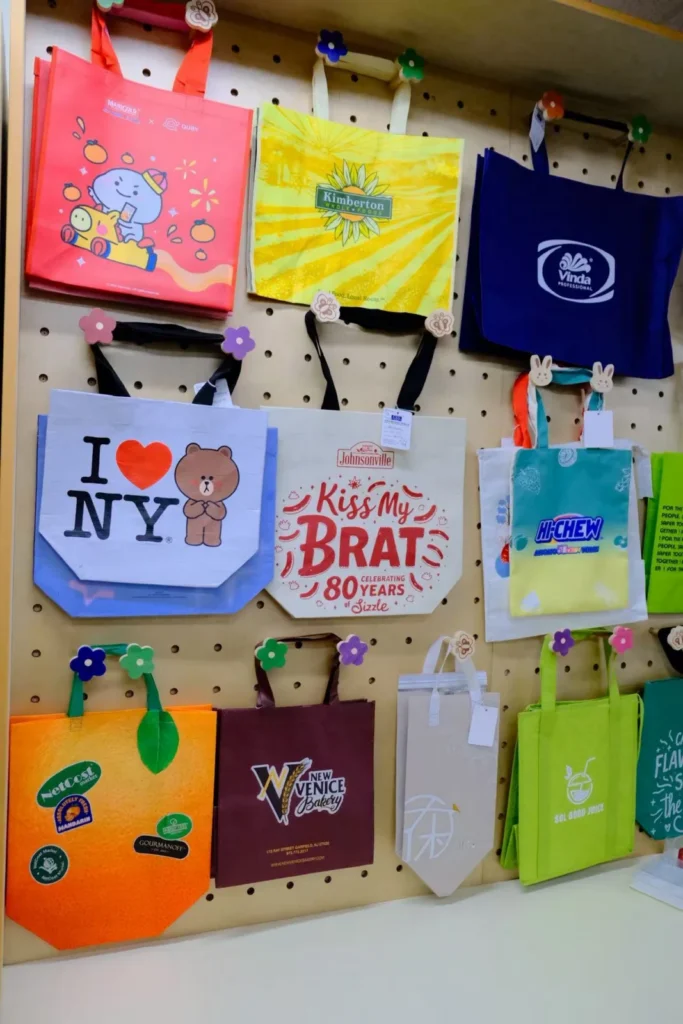 Colorful printed bag samples on the West Coast office display wall